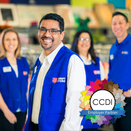 Thrift Store employees standing together with CCDI employer partner logo
