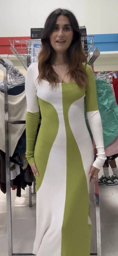 Camille trying on green and white flowy maxi dress