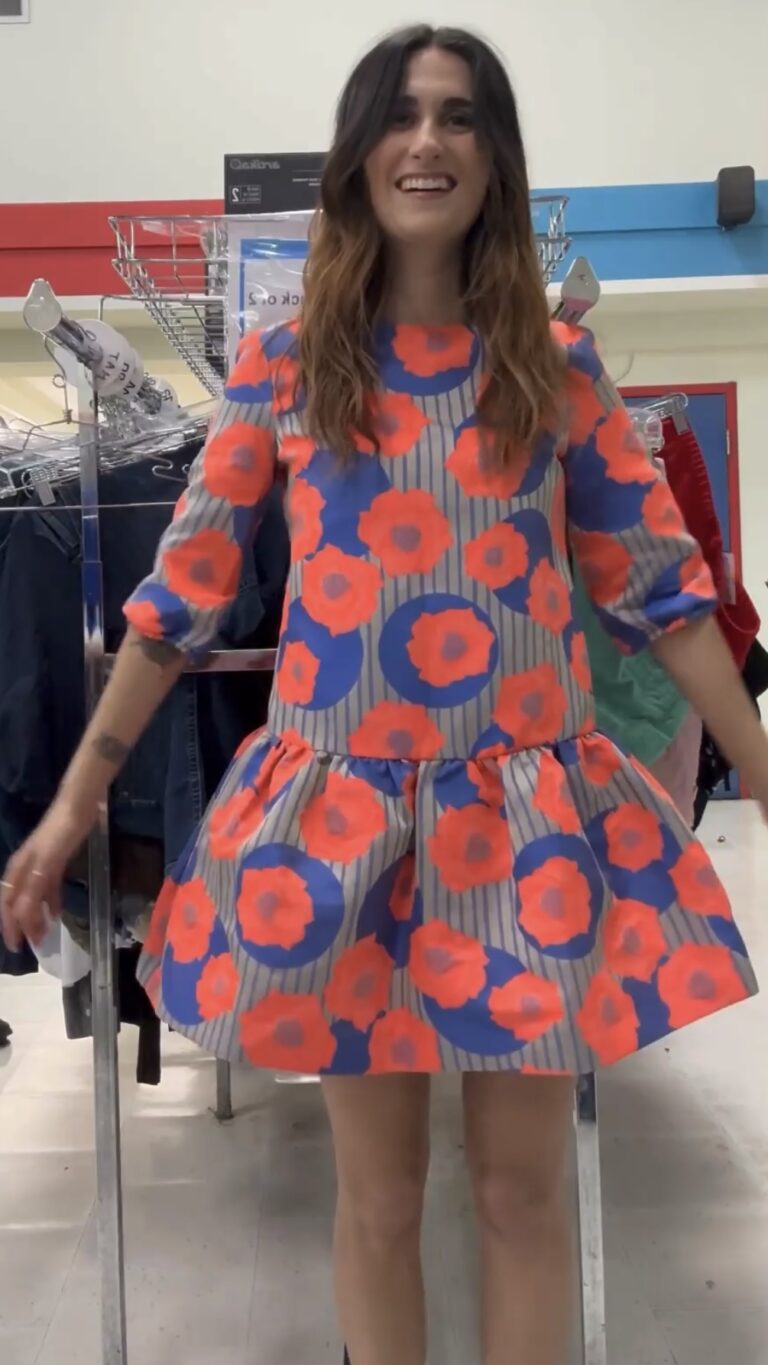 Camille trying on bright floral dress