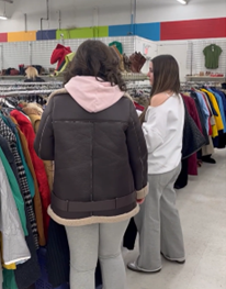 Students thrift shopping for runway outfits 2