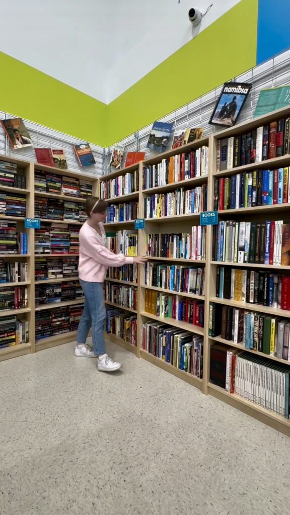 Jade browsing thrifted books section