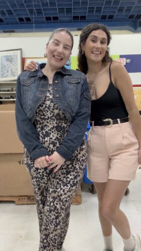 Camille and friend trying on thrifted outfit #1