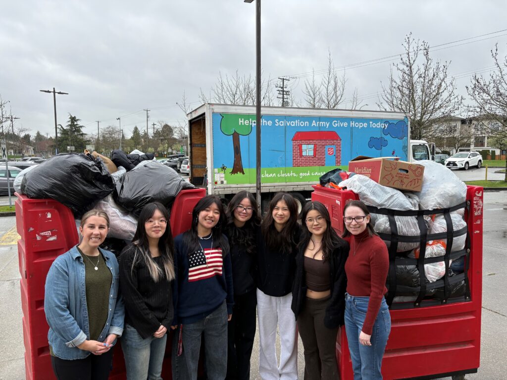 Fashion for Compassion club members posing during clothing donation drive
