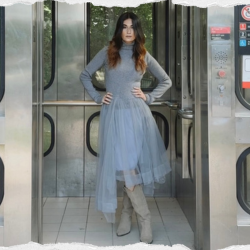 Young woman wearing a thrifted outfit for Secondhand September