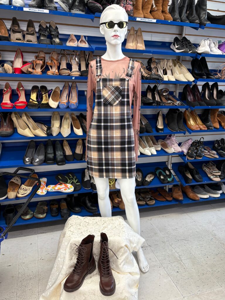 back to school plaid dress and red sheer long sleeve on a mannequin