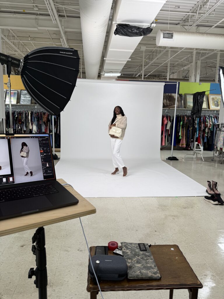 Behind the scene of secondhand september model photoshoot quiet luxury outfit in front of backdrop and lights