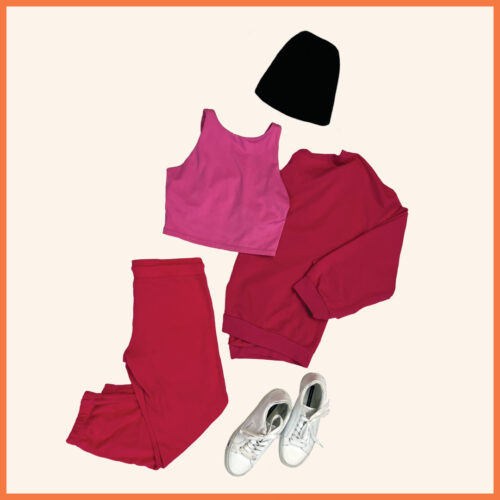 pink cropped top, pink long sleeve sweatshirt, pink pants, white sneakers, black beanie