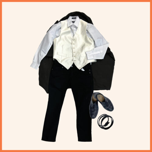white long sleeve button up, white vest, black pants, dress shoes, belt, and black cape