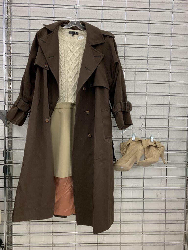 Brown trench coat and cream cableknit