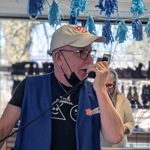 Employee Mike with phone in hand speaking