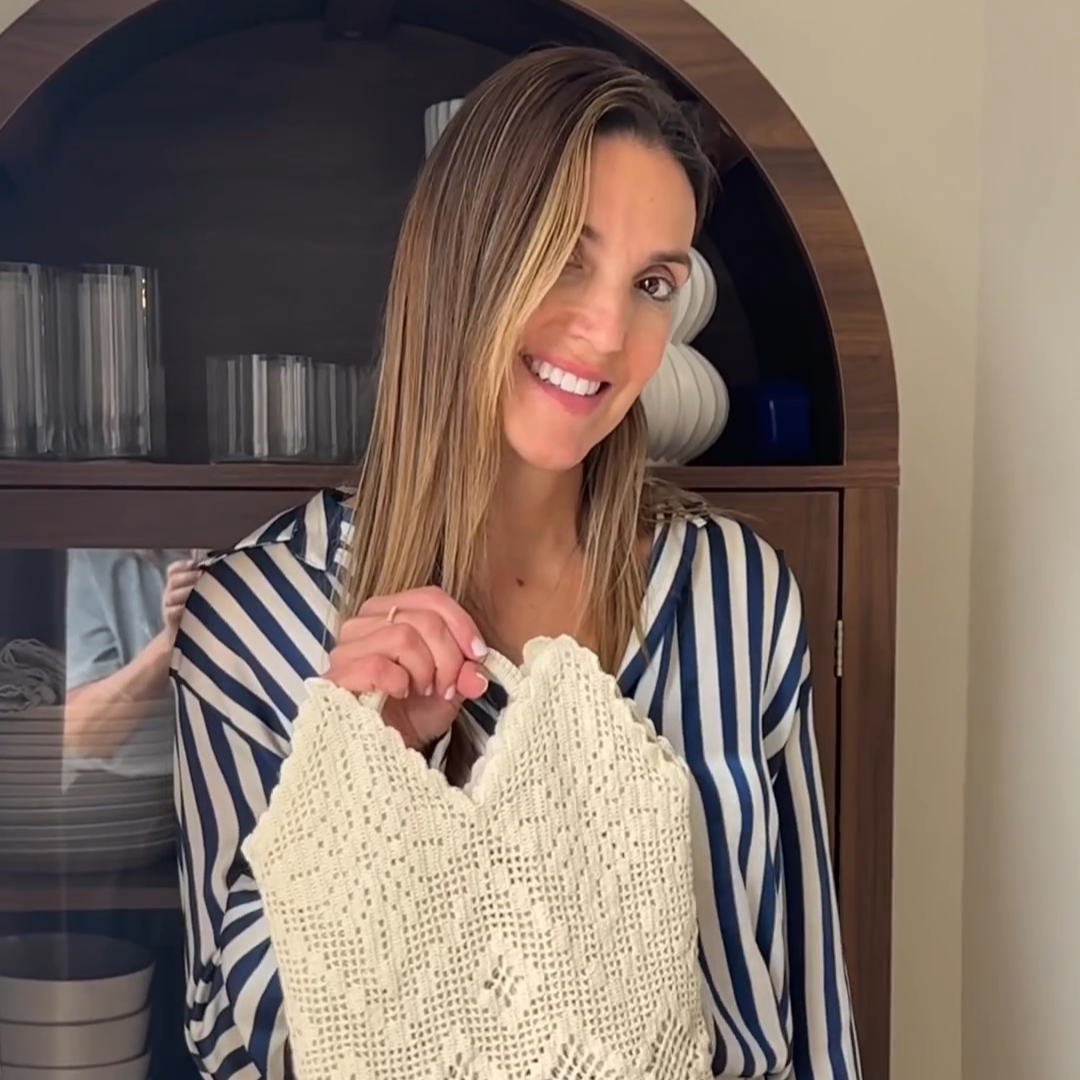 Collaborator Nancy holding a white linen DIY purse