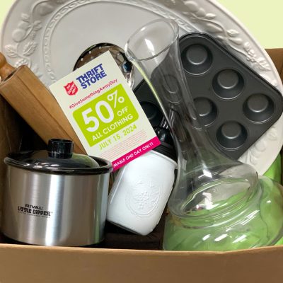 Vase, pot, tray, muffin tins, and other household items in a box for donating